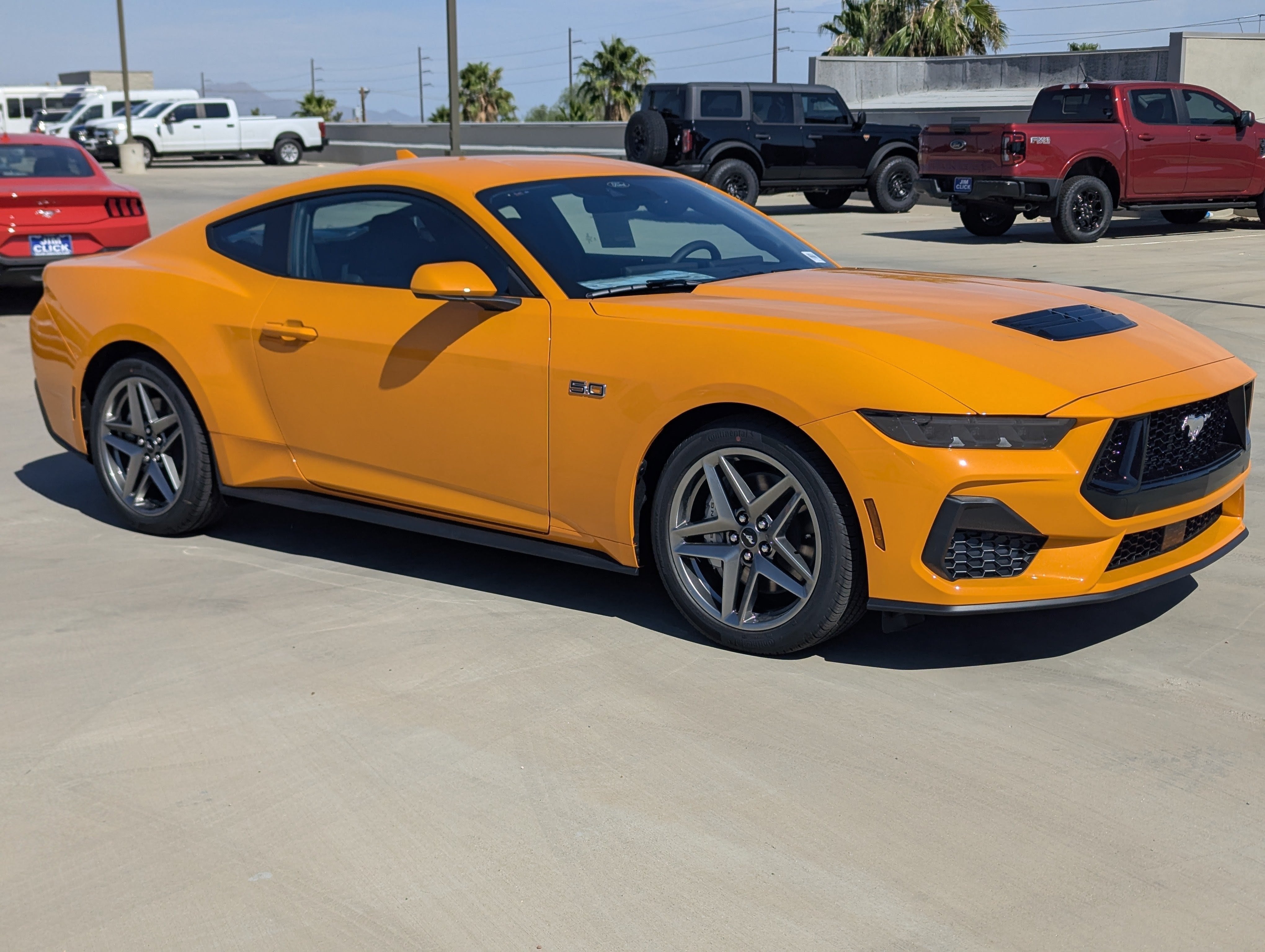 2026 Ford Mustang GT Fastback in Orange Fury Metallic Tri-Coat — front three-quarter view