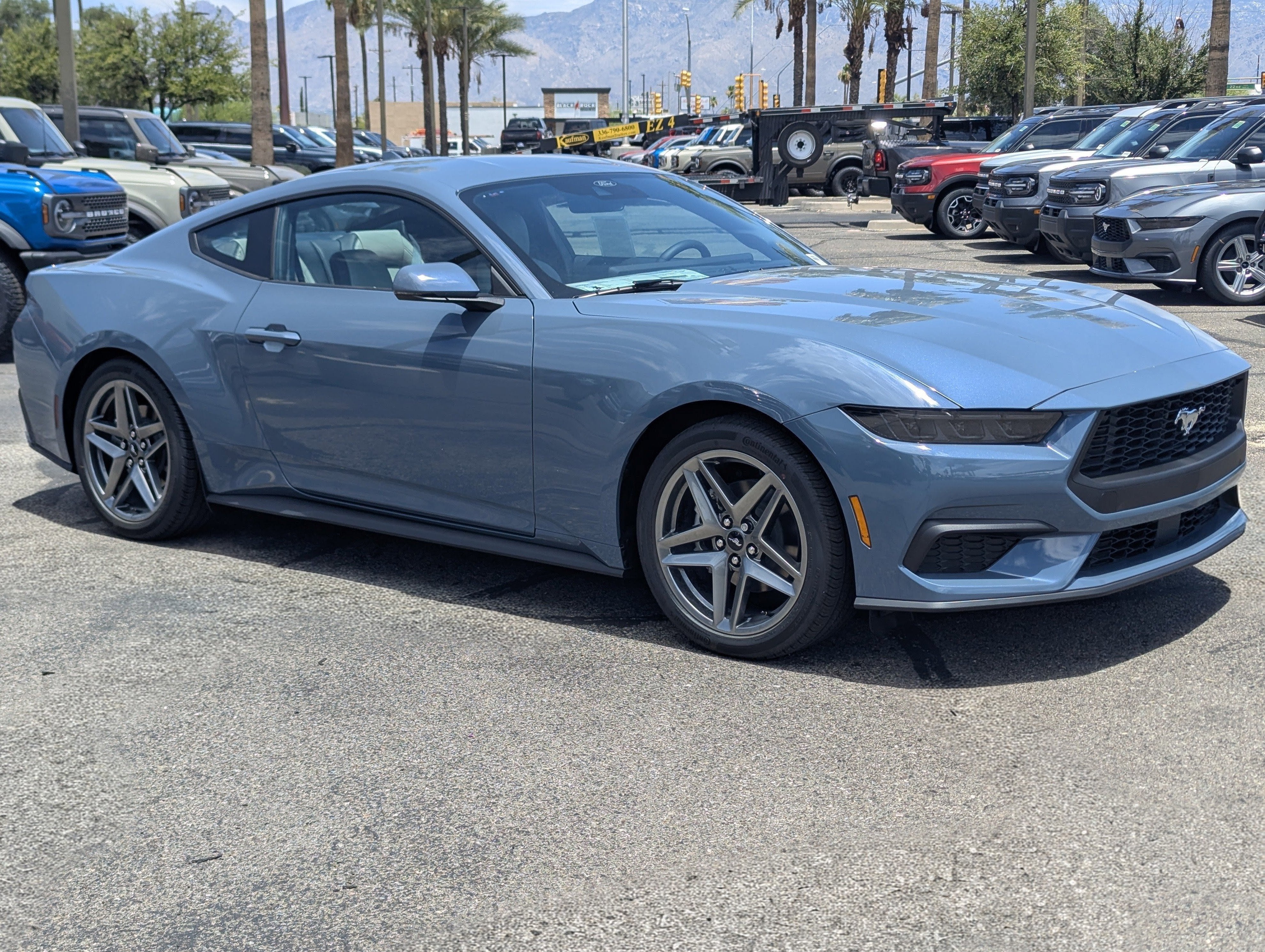 2026 Ford Mustang EcoBoost Premium Fastback in Vapor Blue Metallic — front three-quarter view