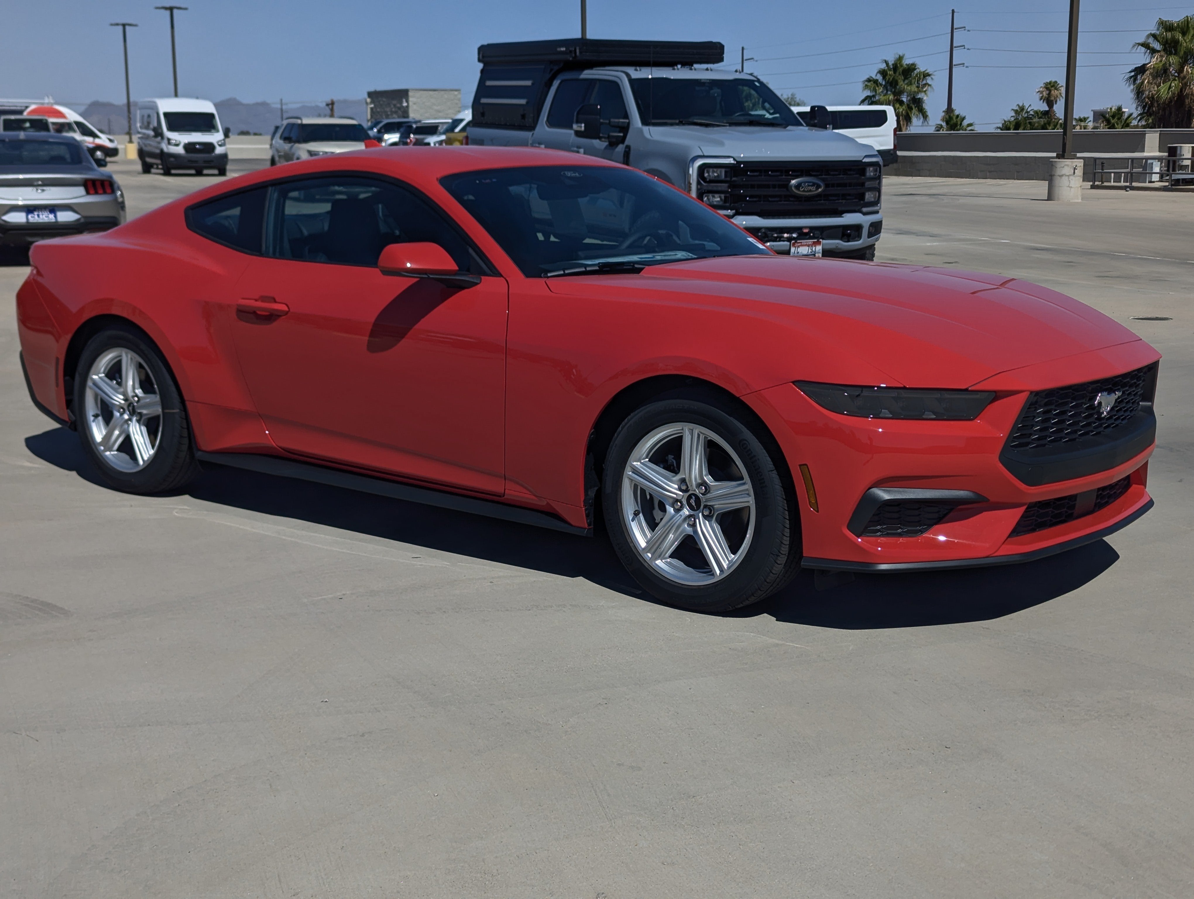 2026 Ford Mustang EcoBoost Premium Fastback in Race Red — front three-quarter view