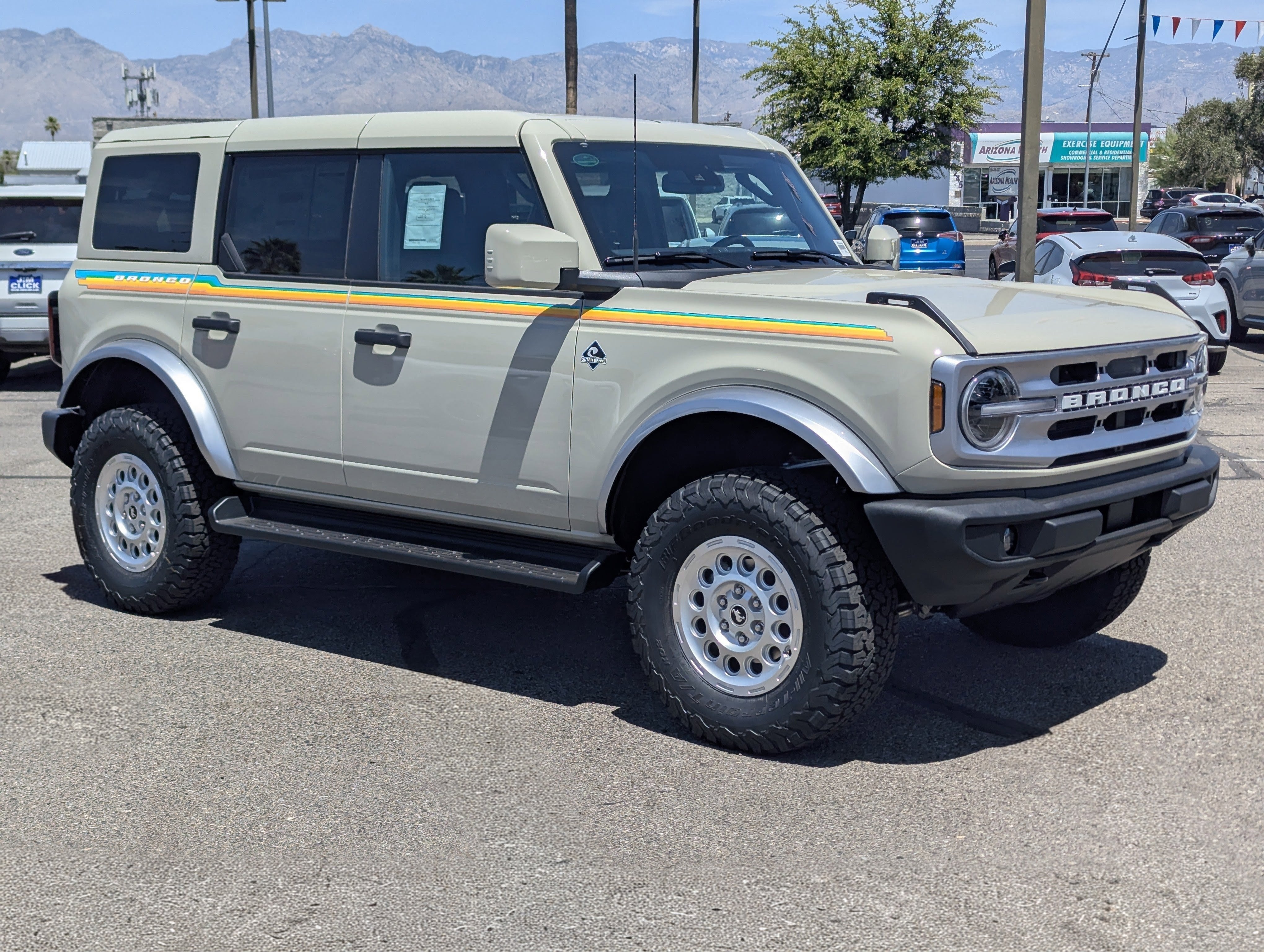 2026 Ford Bronco Outer Banks in Desert Sand — front three-quarter view