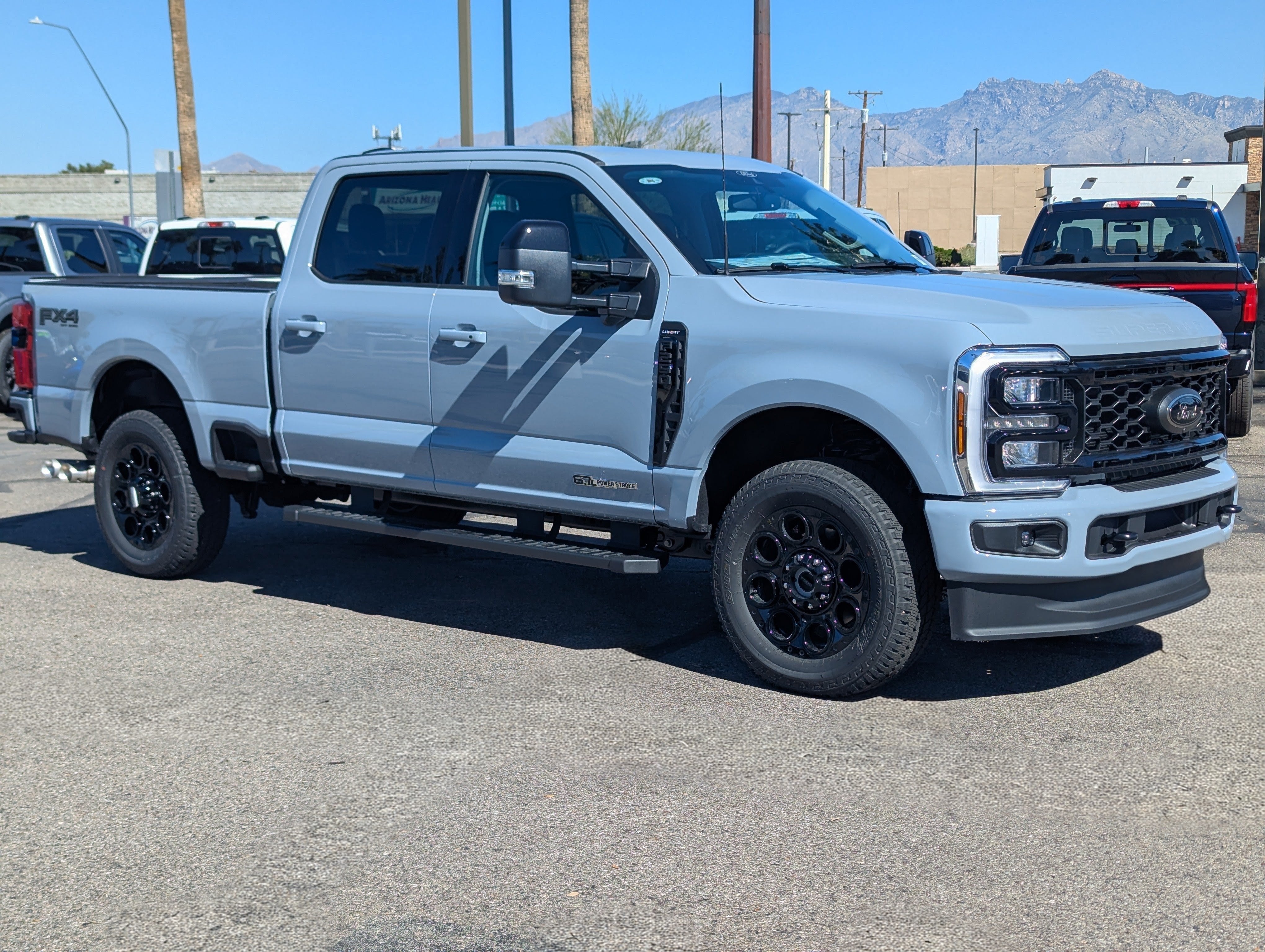 2026 Ford Super Duty F-250 Lariat in Glacier Gray Metallic Tri-Coat — front three-quarter view