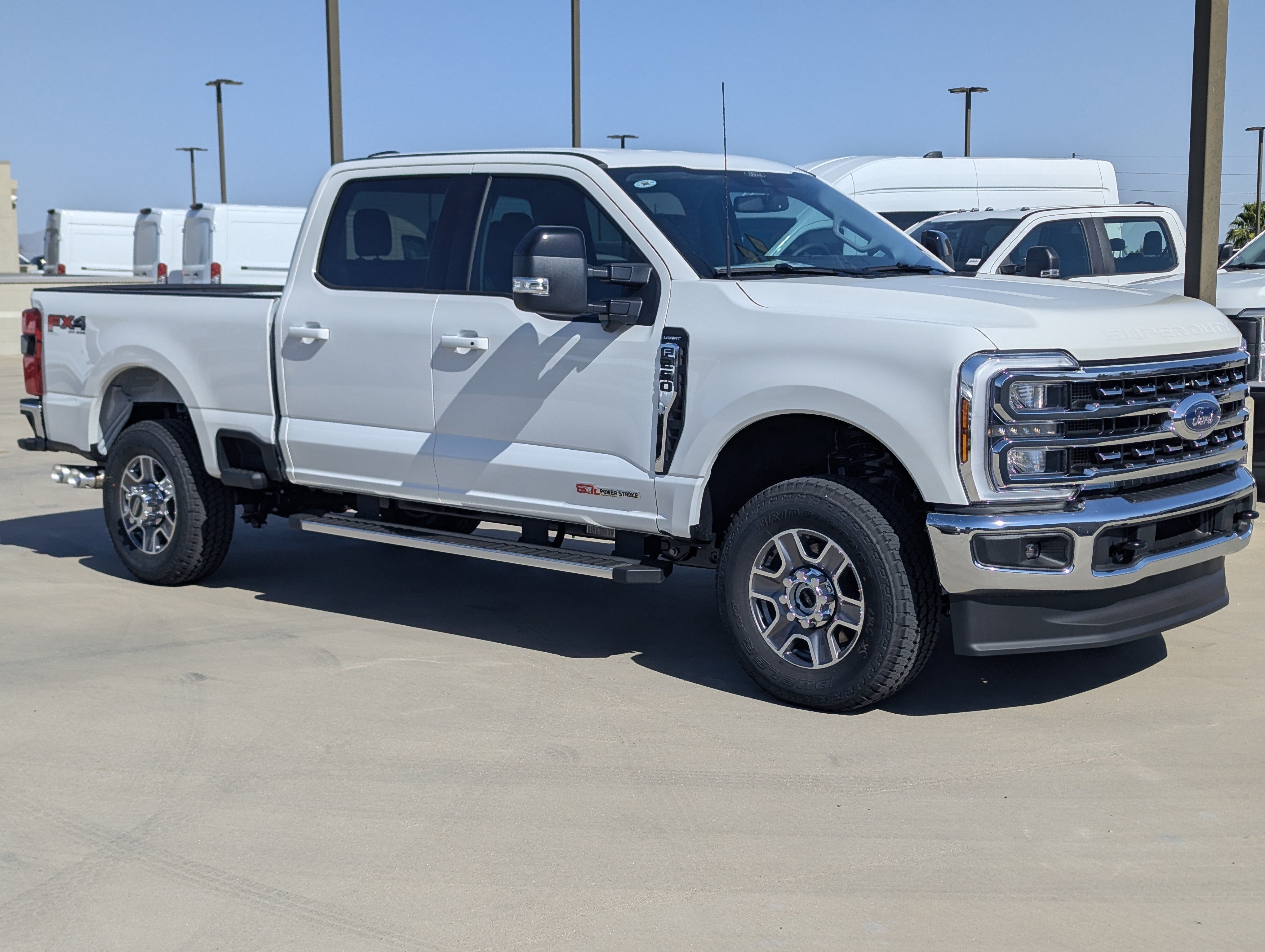 2026 Ford Super Duty F-250 Lariat in Star White Metallic Tri-Coat — front three-quarter view