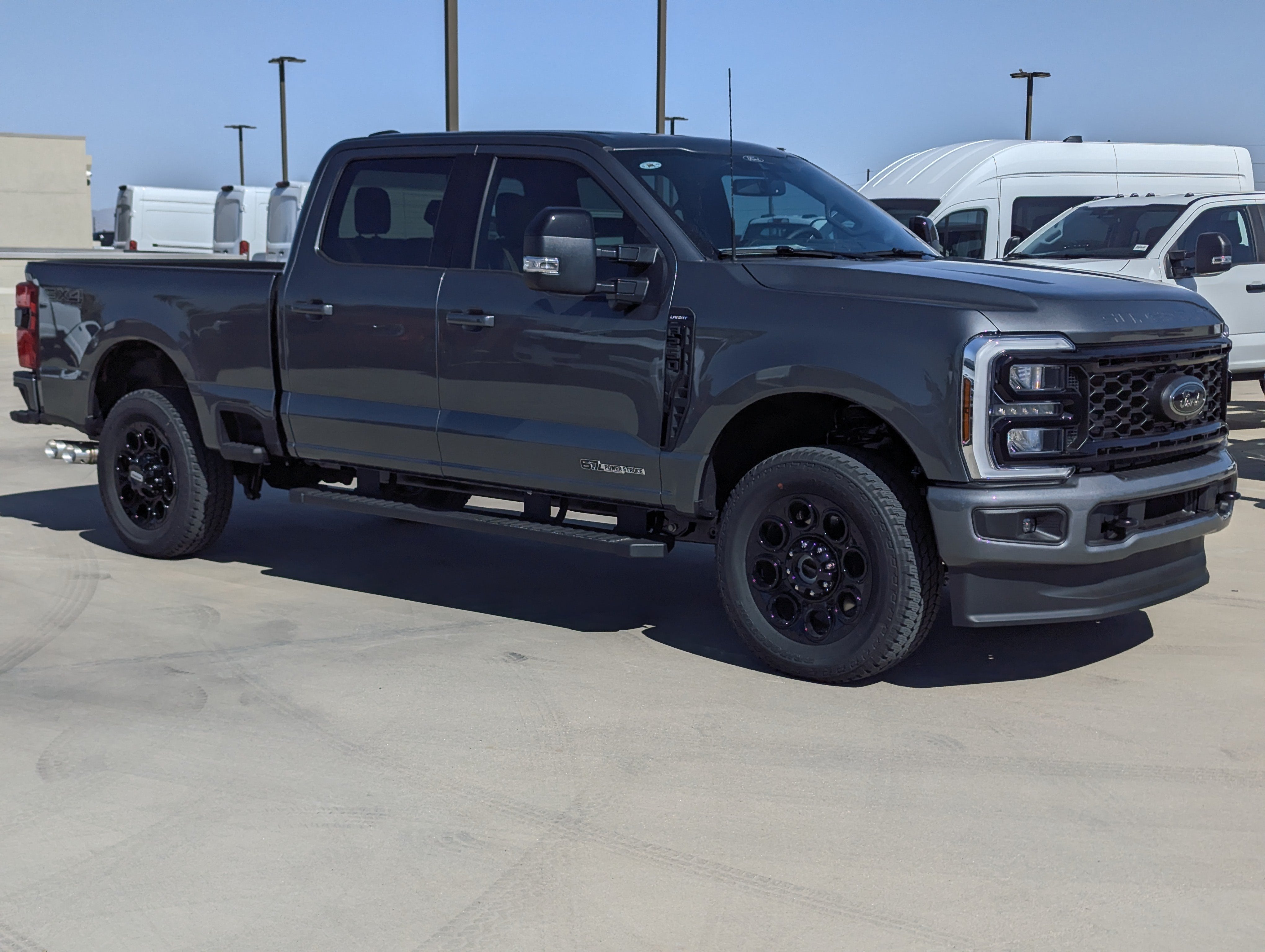 2026 Ford Super Duty F-250 Lariat in Carbonized Gray Metallic — front three-quarter view