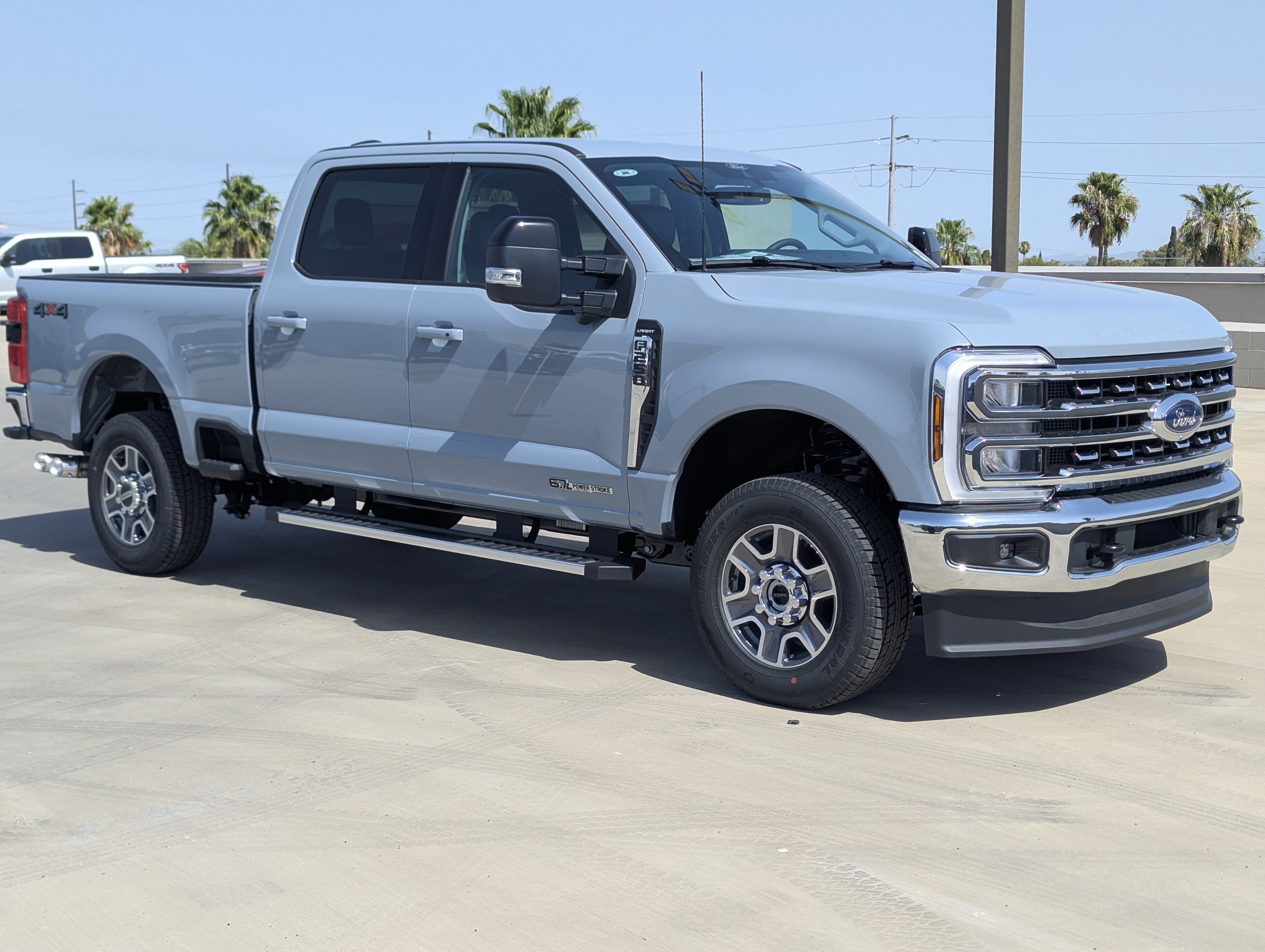 2026 Ford Super Duty F-250 Lariat in Glacier Gray Metallic Tri-Coat — front three-quarter view