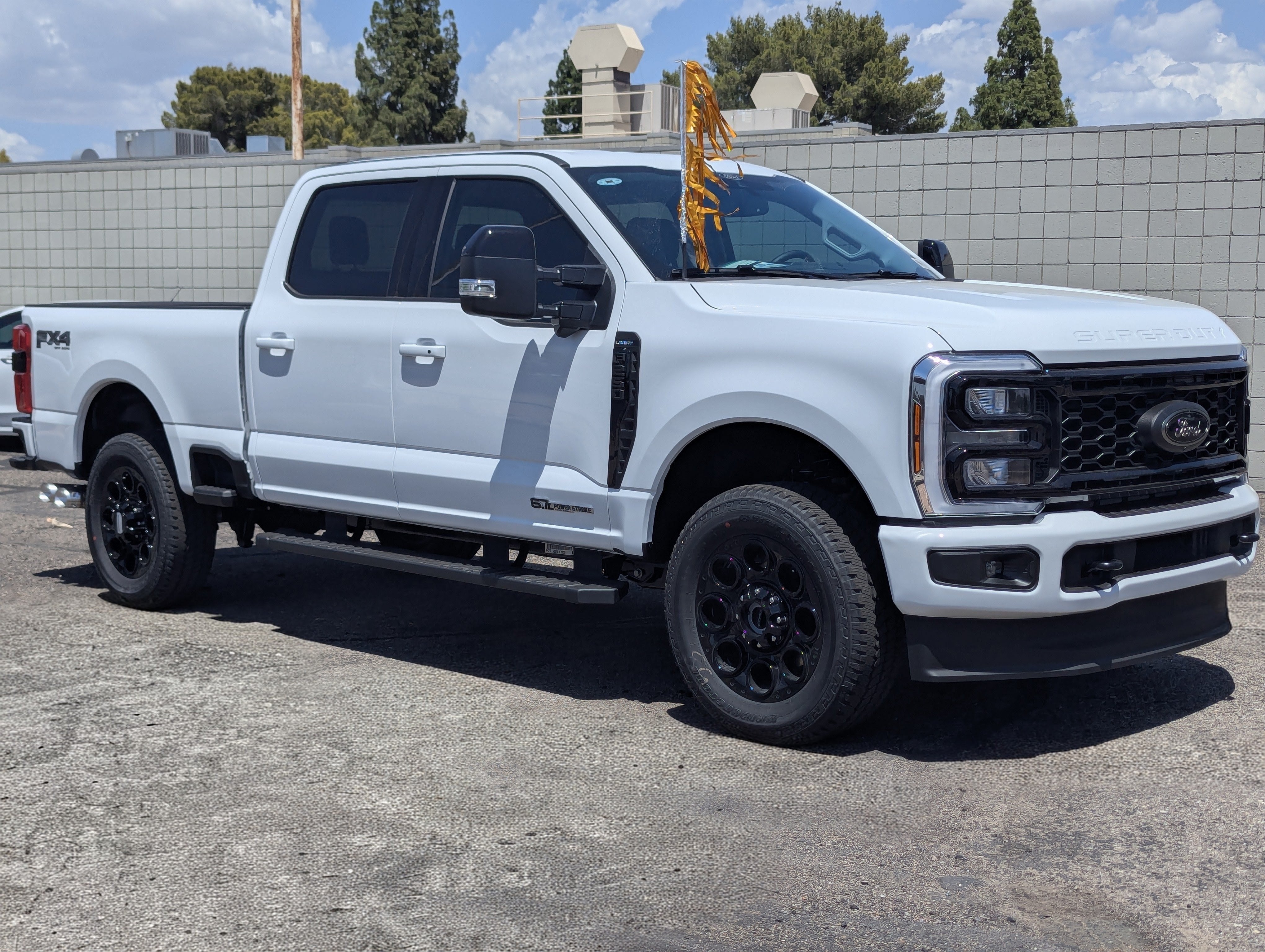 2026 Ford Super Duty F-250 Lariat in Oxford White — front three-quarter view