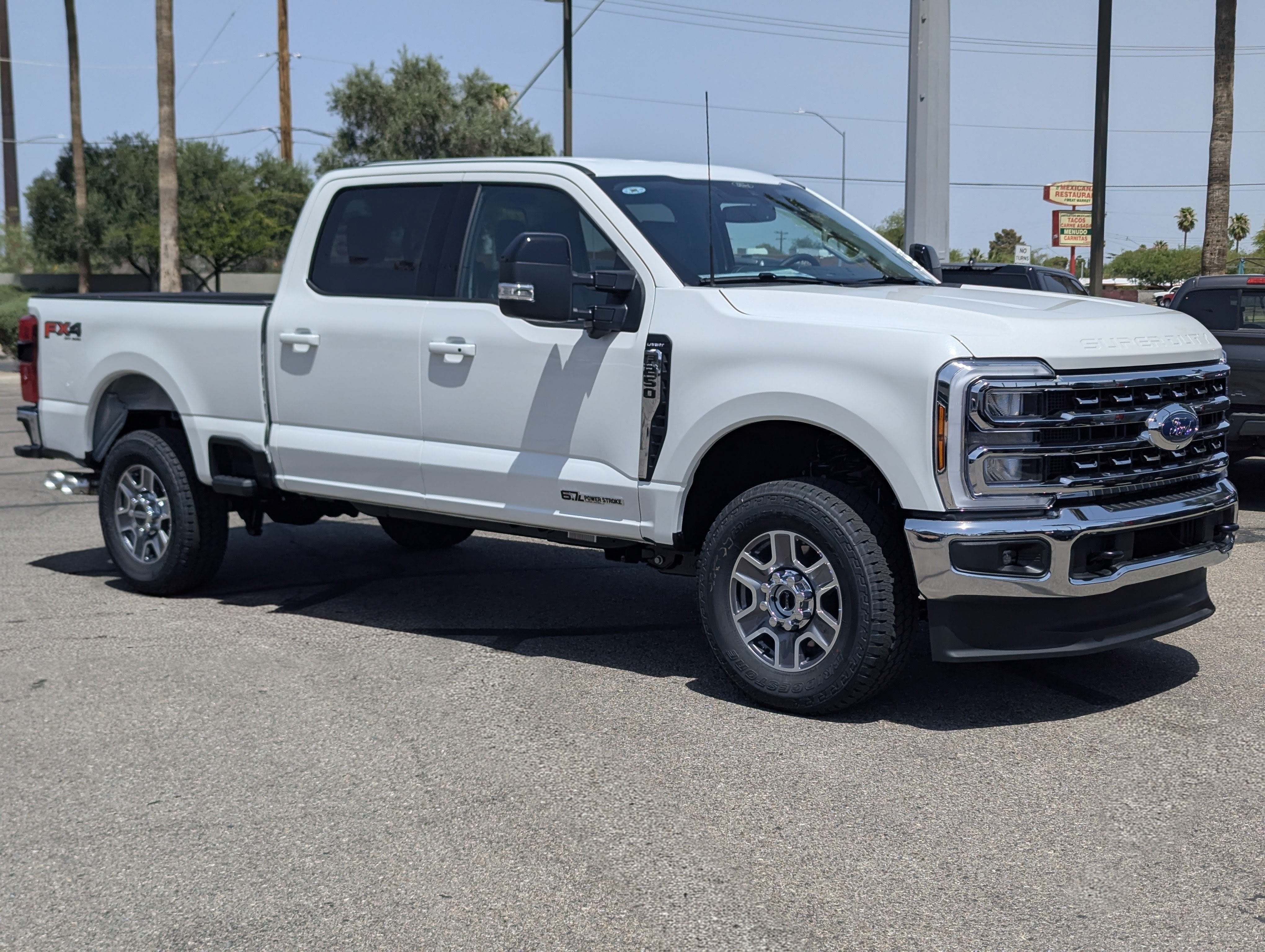 2026 Ford Super Duty F-250 Lariat in Star White Metallic Tri-Coat — front three-quarter view