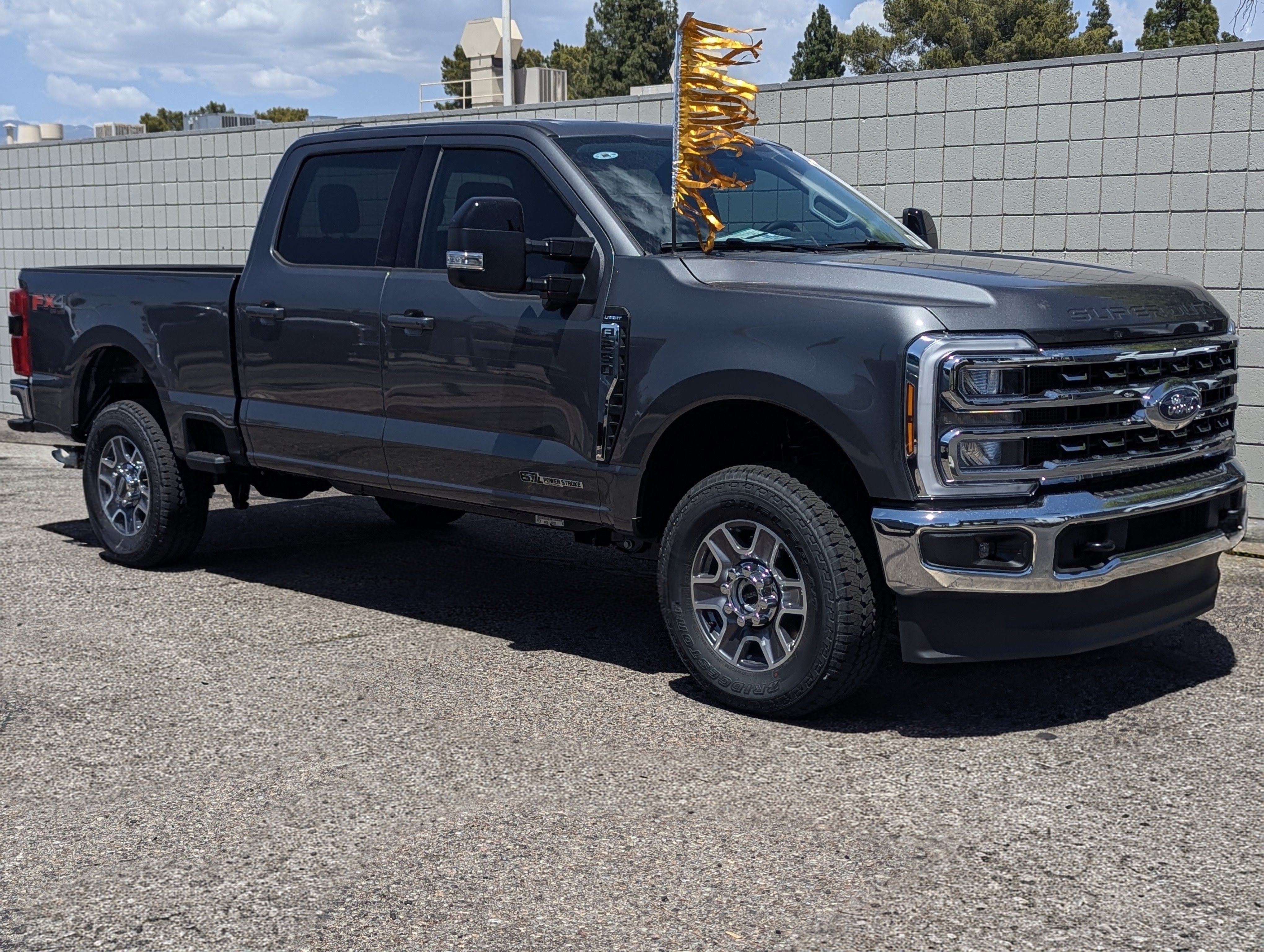 2026 Ford Super Duty F-250 Lariat in Carbonized Gray Metallic — front three-quarter view