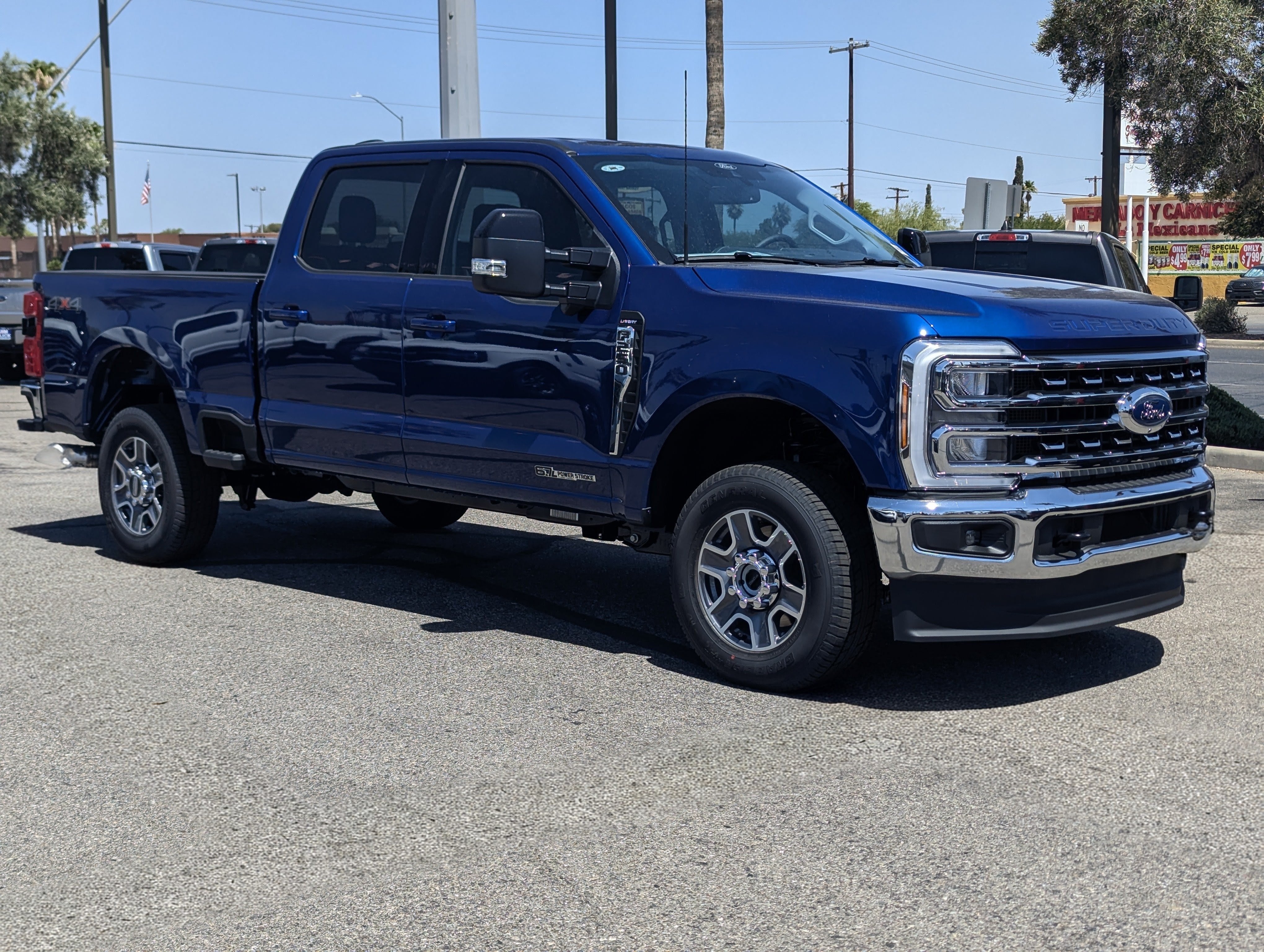 2026 Ford Super Duty F-250 Lariat in Argon Blue Metallic — front three-quarter view