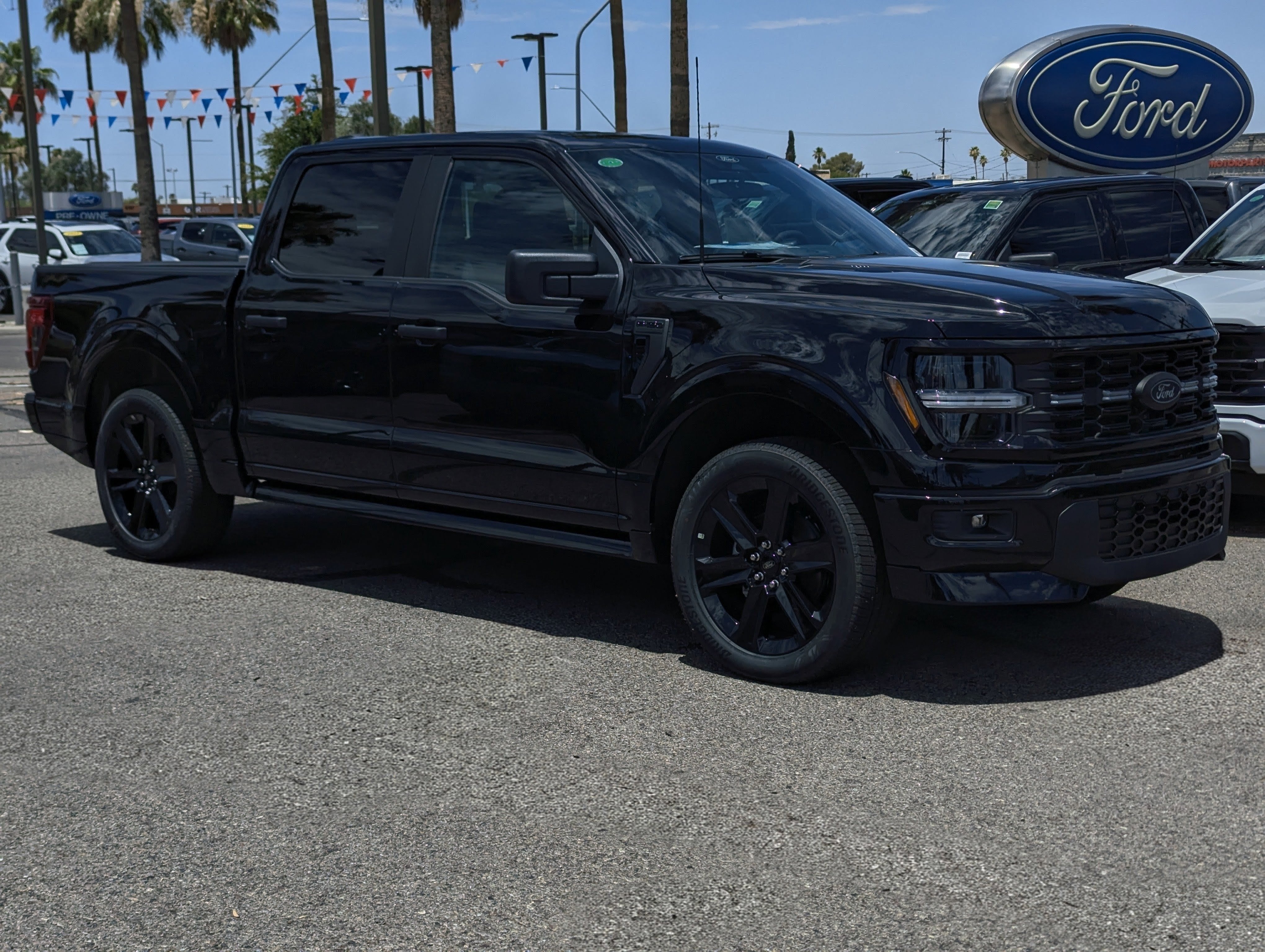 2026 Ford F-150 STX in Agate Black Metallic — front three-quarter view