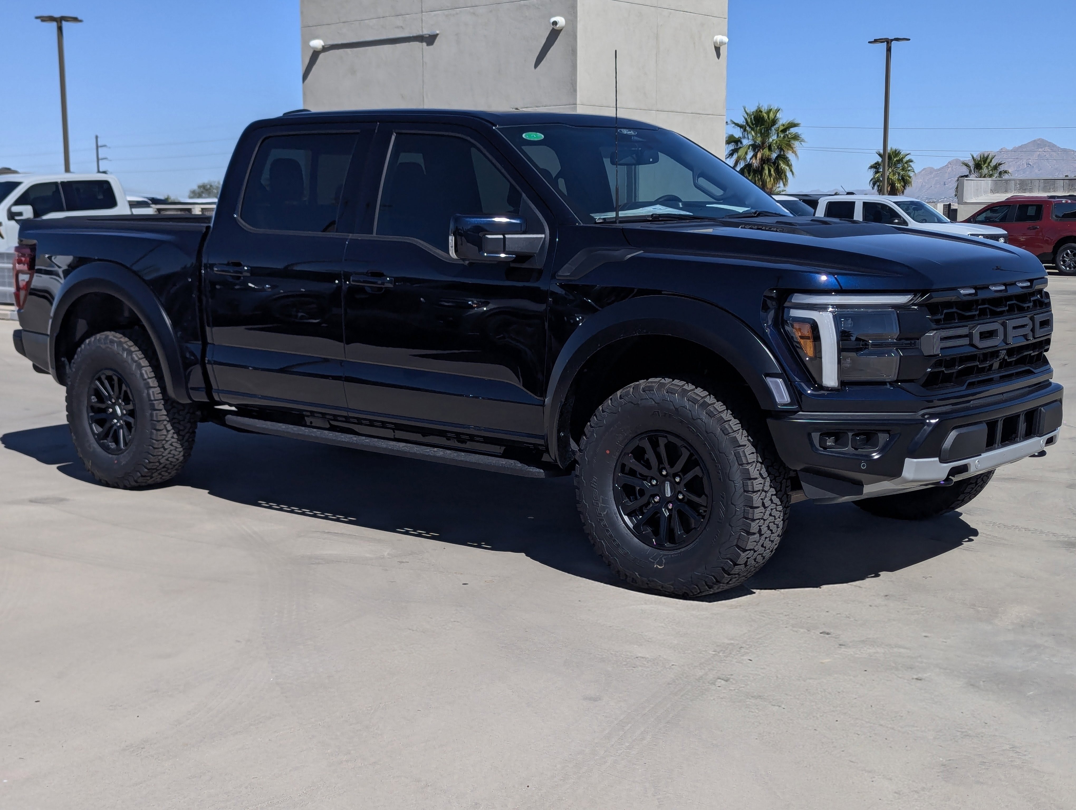 2026 Ford F-150 Raptor in Antimatter Blue Metallic — front three-quarter view