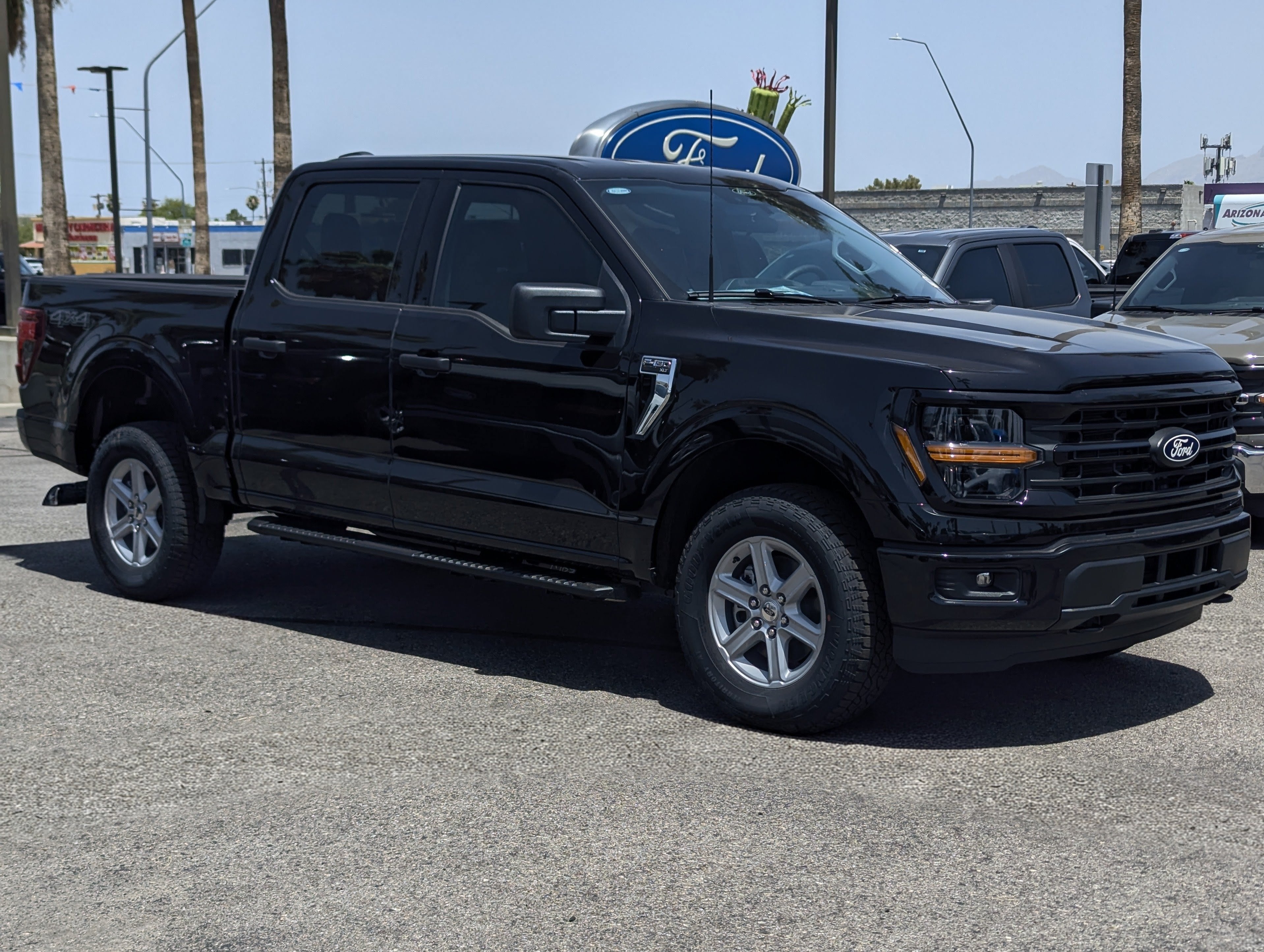 2026 Ford F-150 XLT in Agate Black Metallic — front three-quarter view