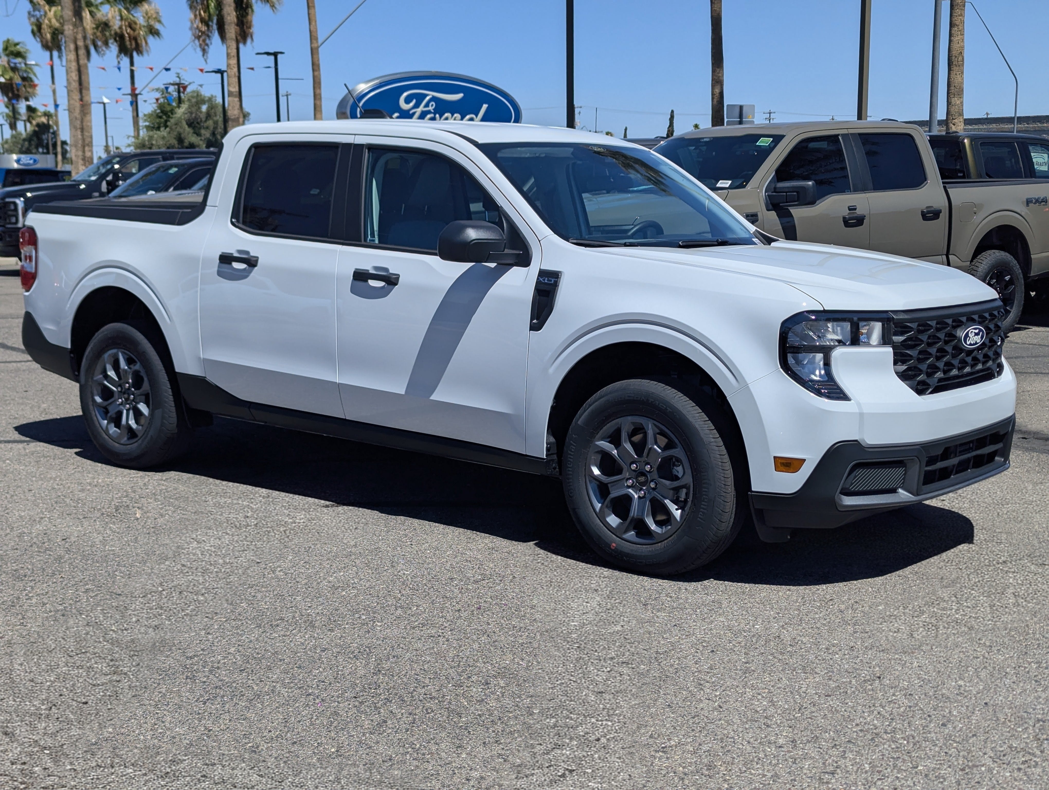 2026 Ford Maverick XLT in Oxford White — front three-quarter view