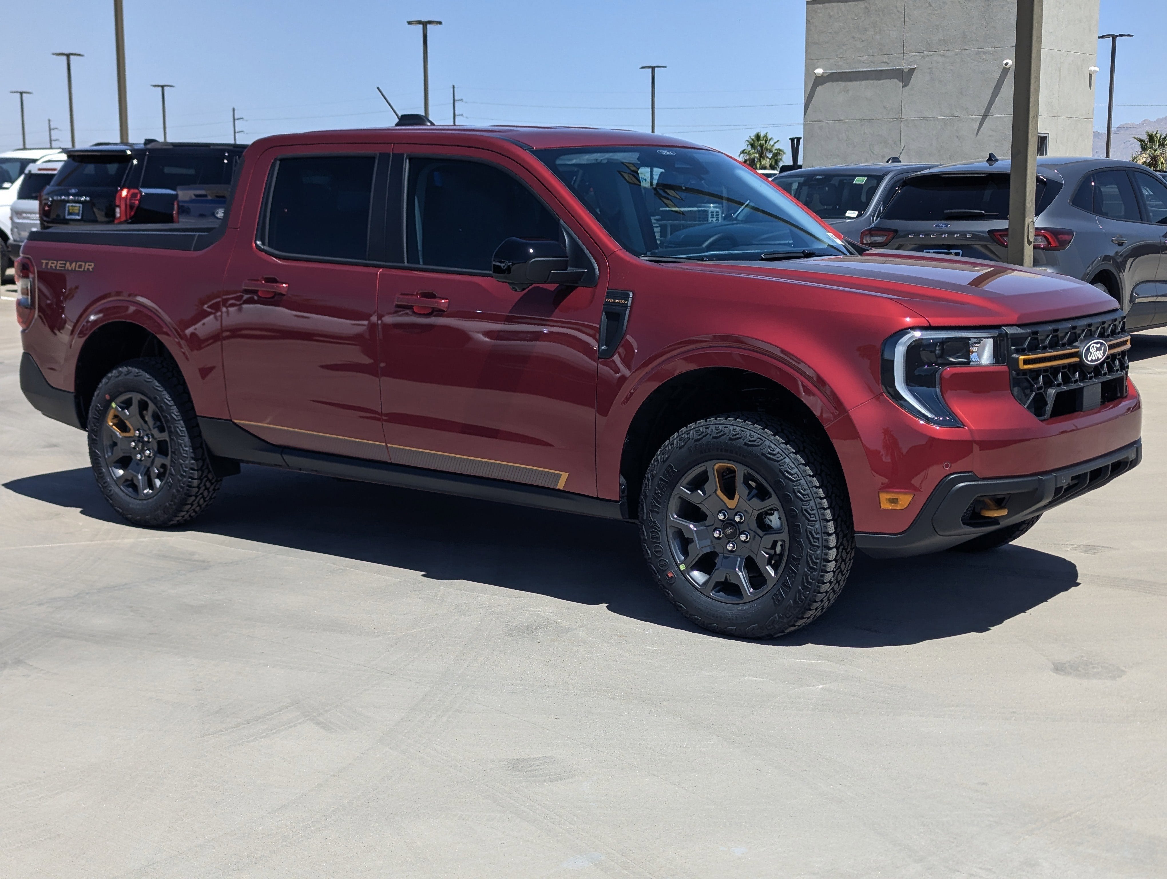 2026 Ford Maverick Tremor in Ruby Red Metallic Tinted Clearcoat — front three-quarter view